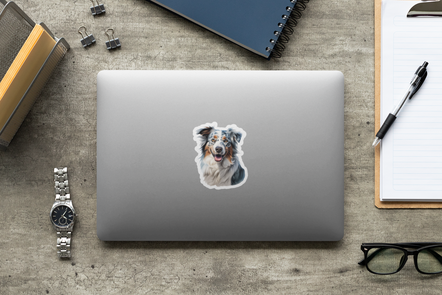 A vinyl sticker depicting an Australian Shepherd dog with a smile, featuring a colorful coat and expressive eyes.