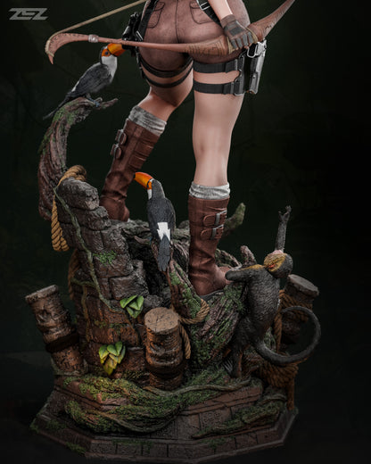 Statue of a character with archery equipment on a naturalistic base.